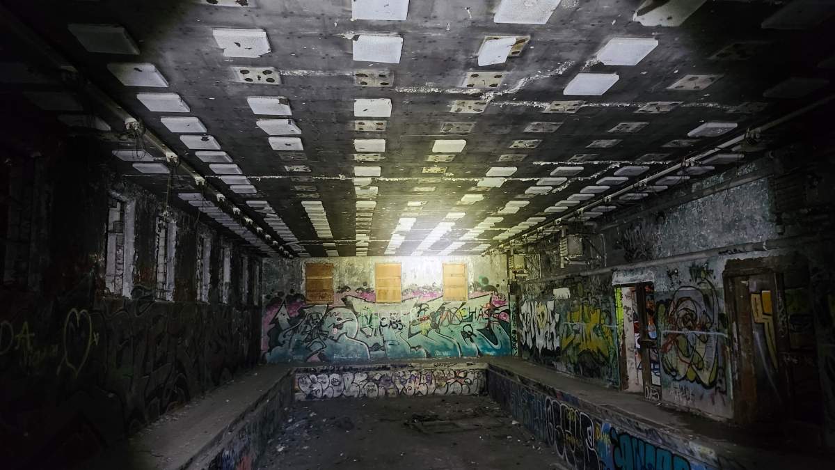 The inside of the former pool building of Camp 30 is pictured.