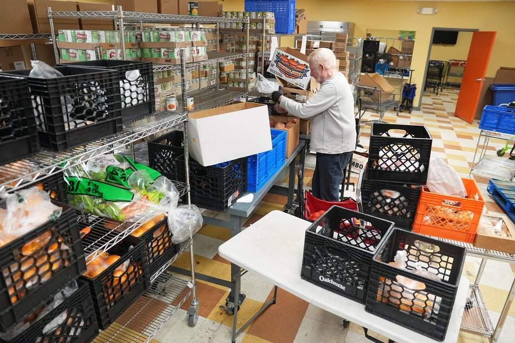 Volunteer Bruce Toben packs groceries durning an emergency food distribution at the at The Jewish Federation of Greater Philadelphia's Mitzvah Food Program in Philadelphia, Friday, Nov. 7, 2025. (AP Photo/Matt Rourke).