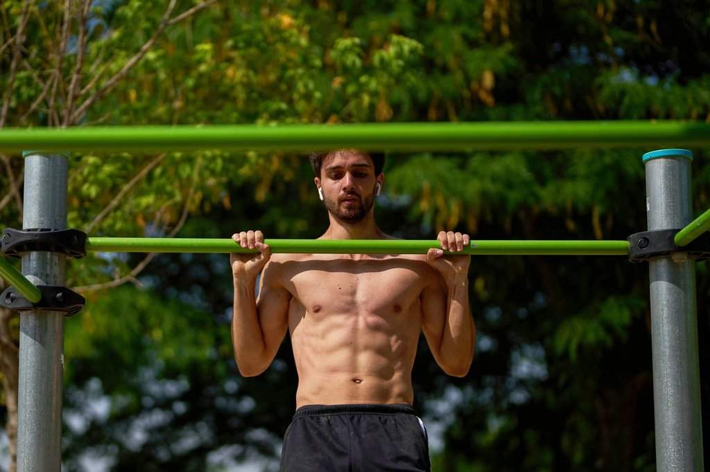 FILE - A man works out in a public park in Madrid, Spain on July 1, 2025. (AP Photo/Manu Fernandez, File).