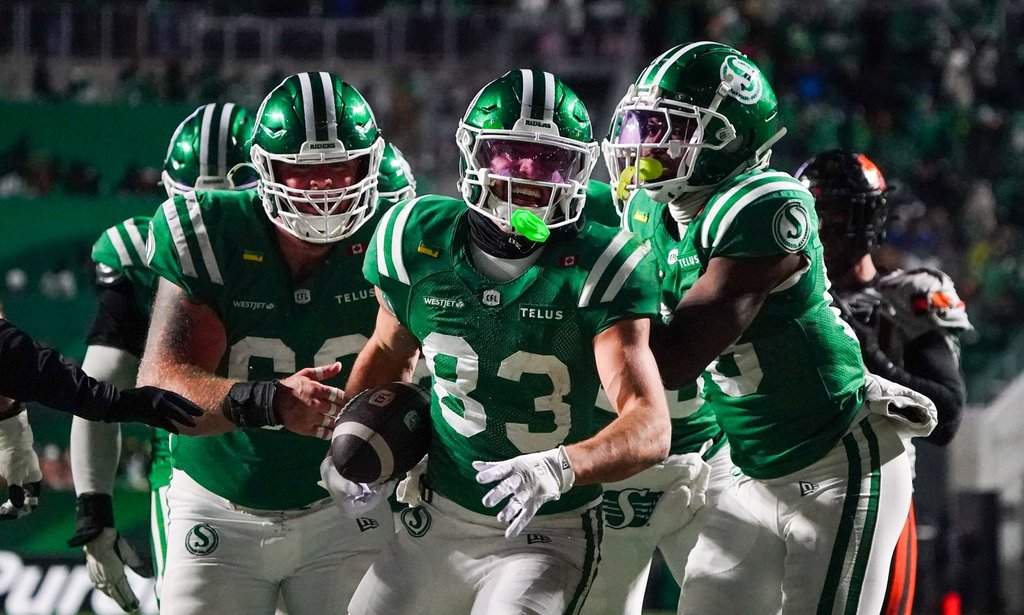 Saskatchewan Roughriders receiver Tommy Nield (83) celebrates with teammates after scoring a touchdown against the B.C. Lions during the second half of CFL West Division final football action in Regina, on Saturday, Nov. 8, 2025.