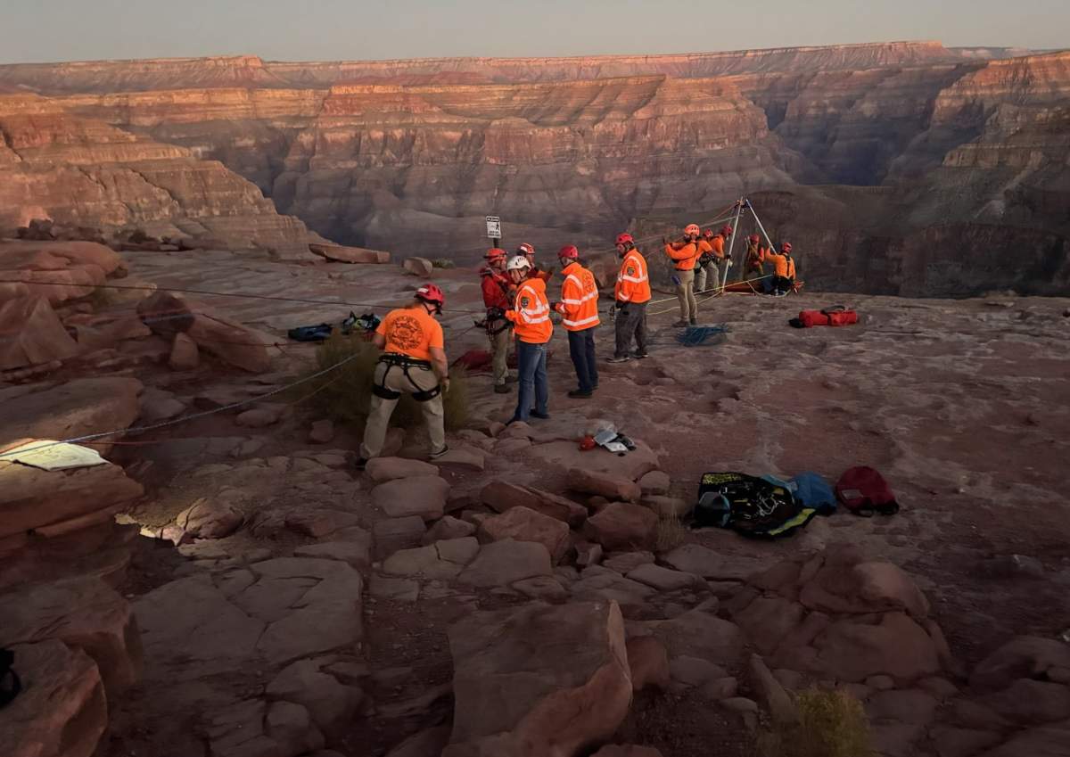 Rope technicians use a lowering/raising system to recover the body.