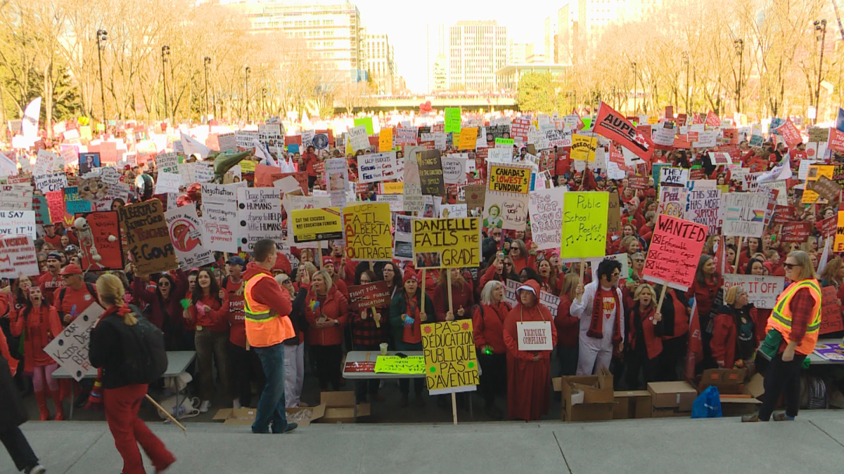 Teachers rally out front of the Alberta Legislature.