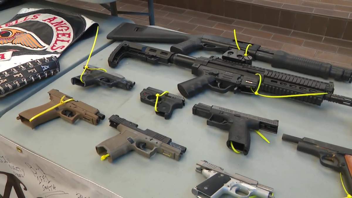 Guns, which were seized during an investigation into the One Order Motorcycle Club setting up a chapter in Edmonton, on display on Tuesday, November 25, 2025.