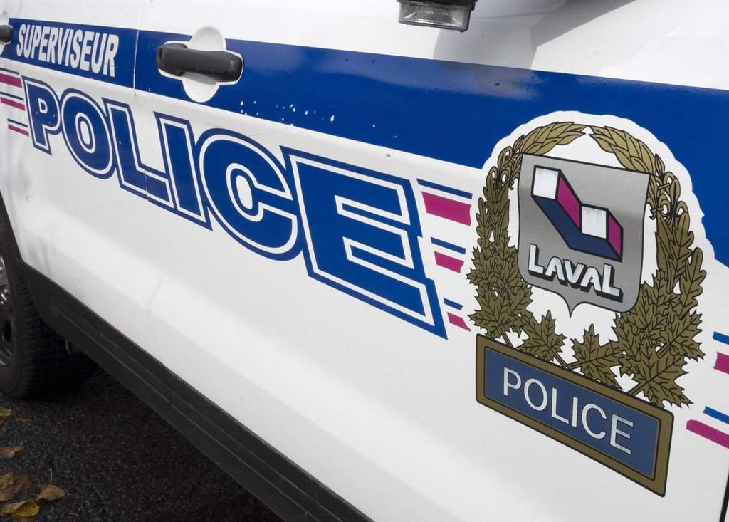 A Laval police logo is seen on a police car in Laval, Que., Tuesday, Oct. 18, 2022.