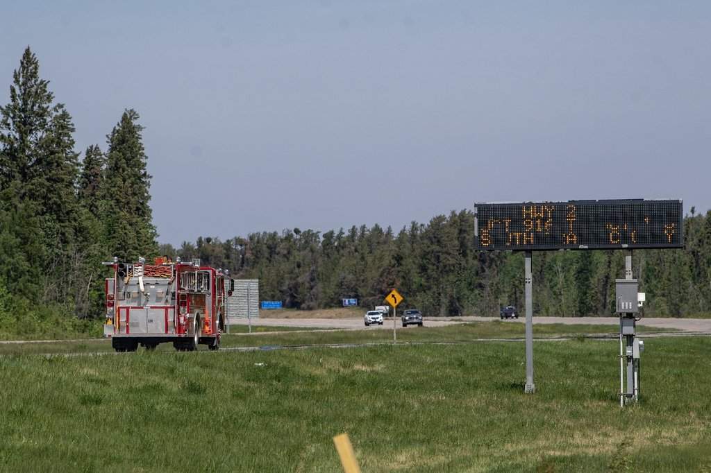 Volunteer firefighters from Davidson, Sask., load up their truck at the Provincial Wildfire Center in Prince Albert, Sask., Wednesday, June 4, 2025. The fire fighters are on their way to Weyakwin. 