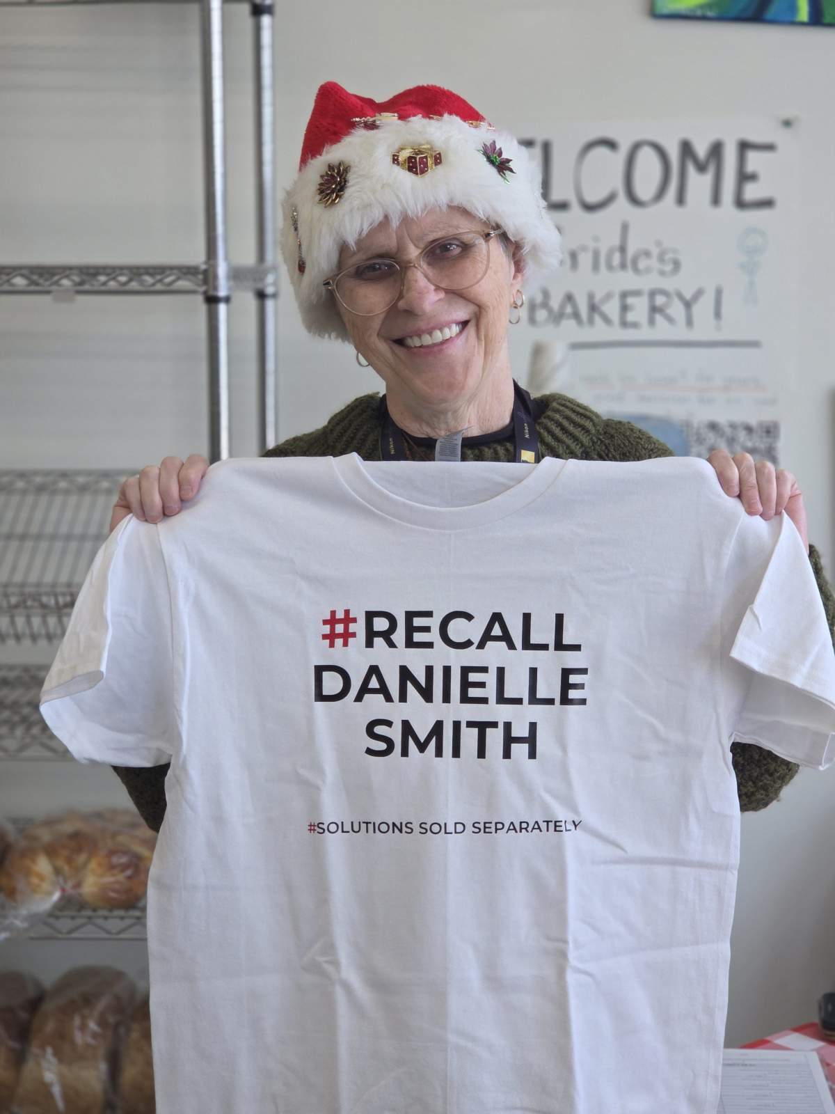A resident of Medicine Hat, Alta. working on the recall petition for local MLA, Premier Danielle Smith, in December 2025.