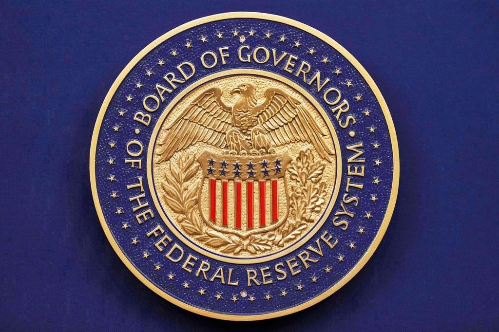 FILE - A seal is seen before Federal Reserve Chairman Jerome Powell walks out to speak during a news conference following the Federal Open Market Committee meeting, Sept. 17, 2025, at the Federal Reserve Board Building in Washington. (AP Photo/Jacquelyn Martin, File).