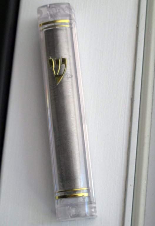 In this June 30, 2013 photo, a new mezuzah hangs in the doorway of a home.