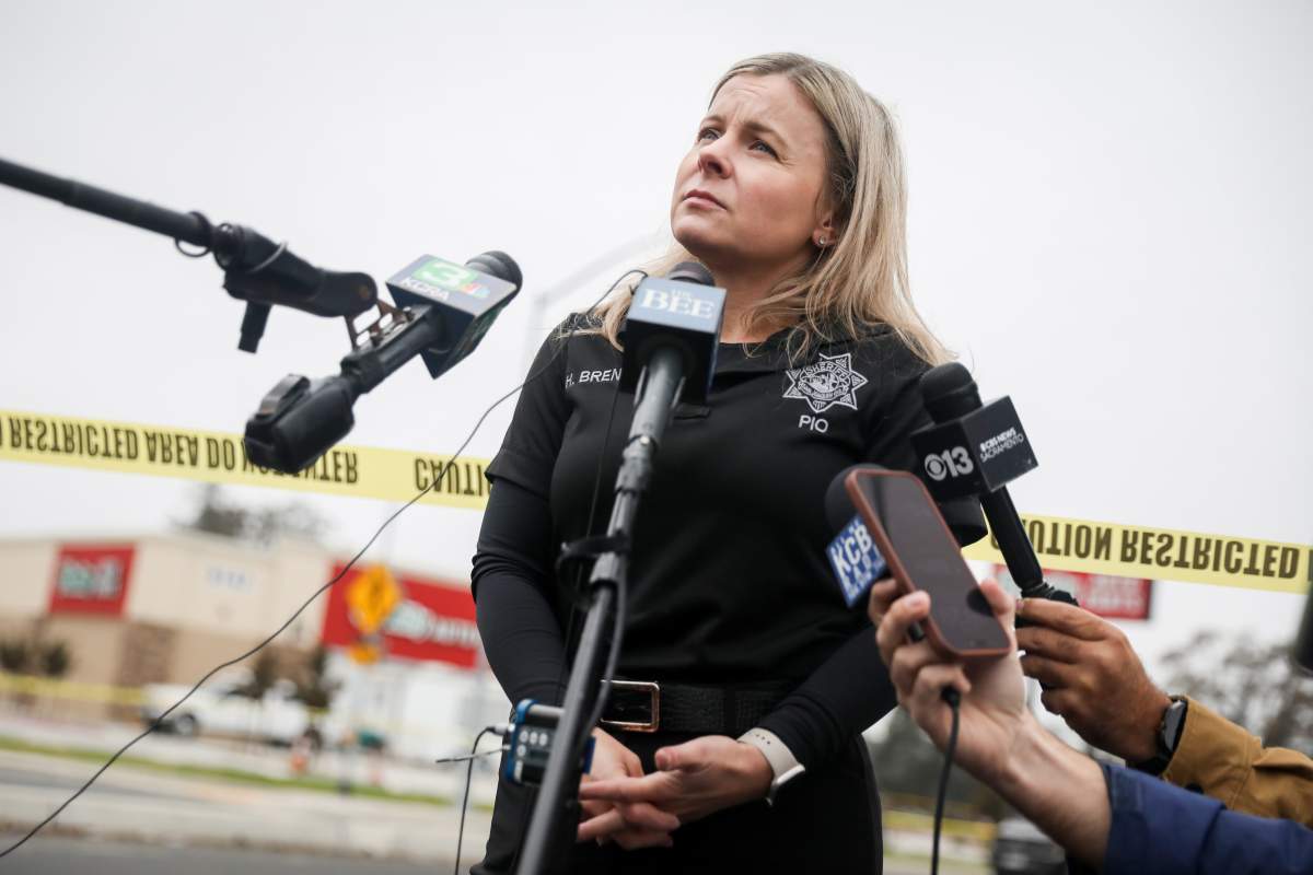Public Information Officer Heather Brent with the San Joaquin Sheriff's Department speaks with members of the press at Thornton Blvd. and Lucile Ave., near the site of Saturday's shooting at a banquet hall in Stockton, Calif., Sunday, Nov. 30, 2025.