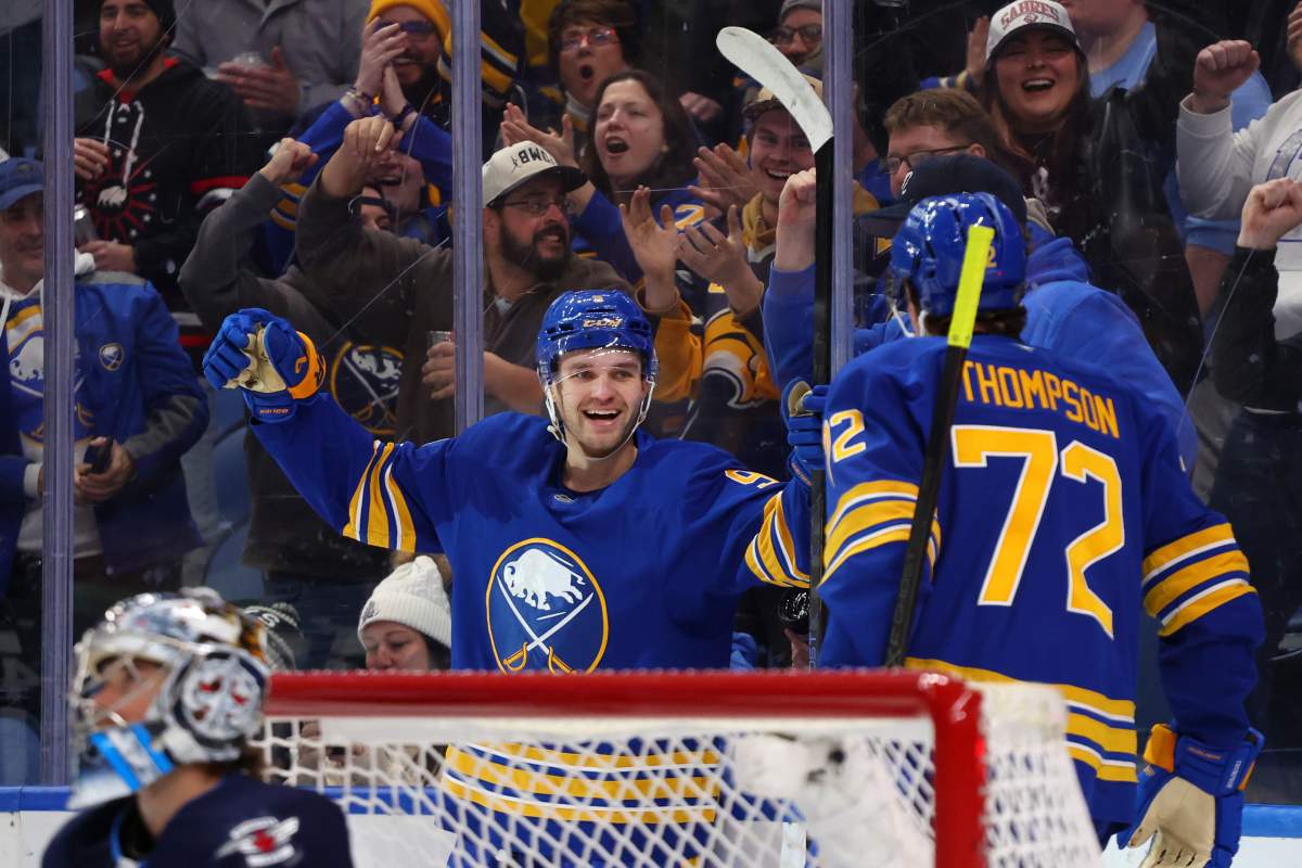 Buffalo Sabres center Josh Norris (9) celebrates his goal with center Tage Thompson (72) during the first period of an NHL hockey game against the Winnipeg Jets, Monday, Dec. 1, 2025, in Buffalo, N.Y. (AP Photo/Jeffrey T. Barnes).