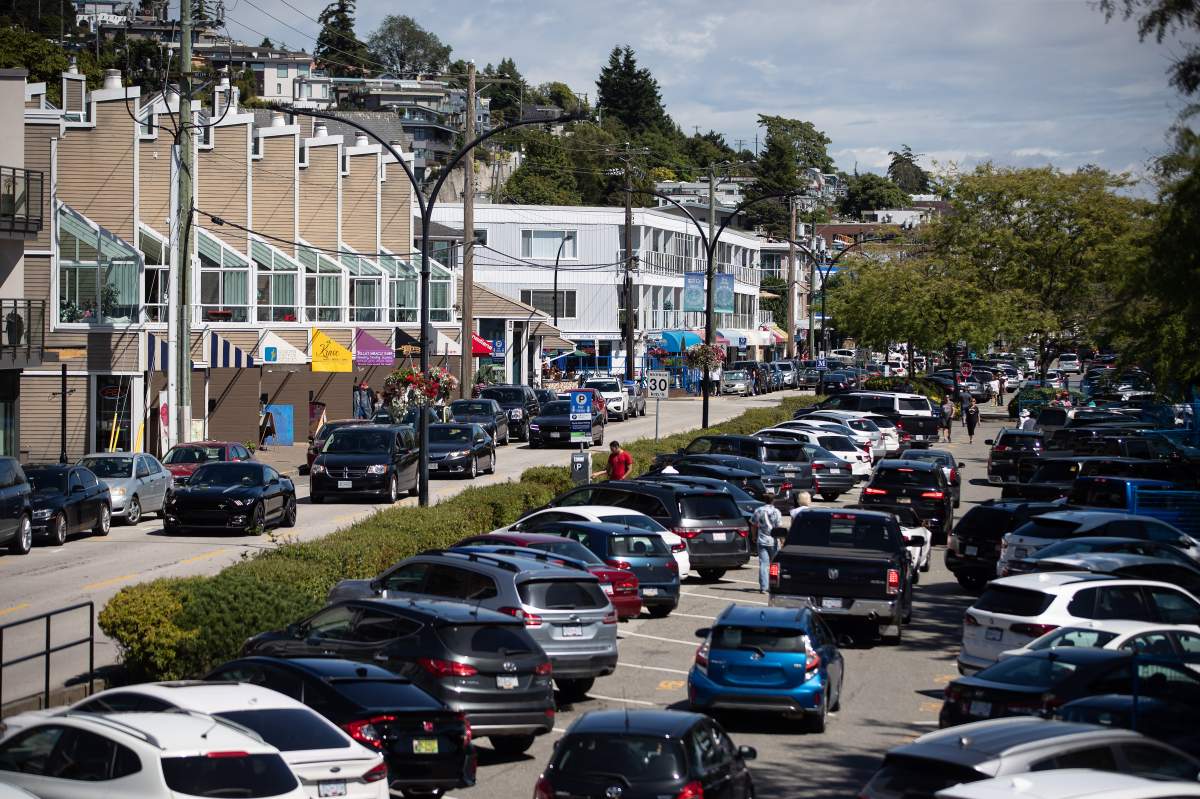 FILE -- Motorists fill the parking lots and roads on the waterfront in White Rock, B.C., on Sunday, June 28, 2020.