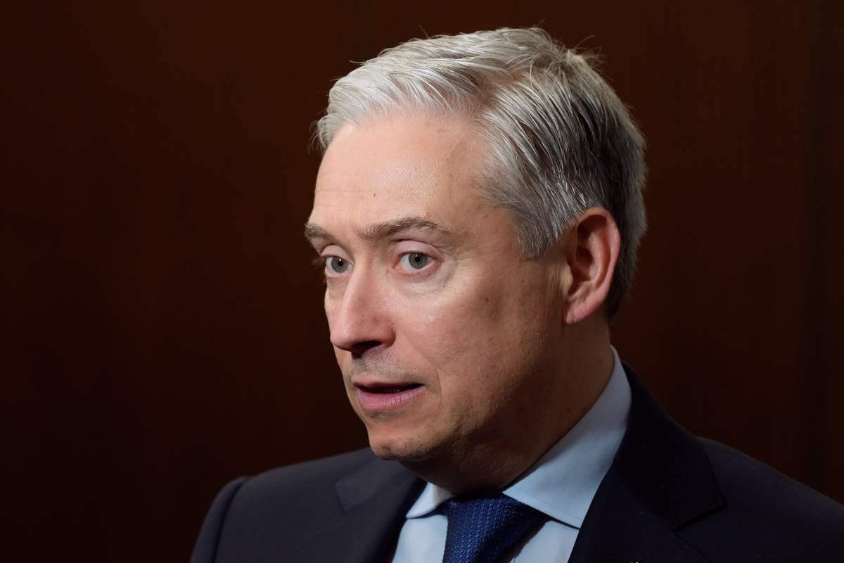 Minister of Finance and National Revenue Francois-Philippe Champagne speaks with reporters as he makes his way to cabinet followng Question Period on Parliament Hill in Ottawa, Tuesday, Nov. 25, 2025.