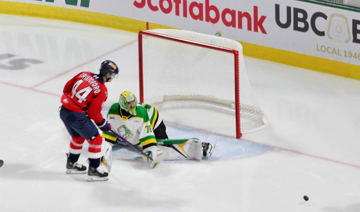 Aleksei Medvedev of the London Knights stops Anthony Cristoforo of the Windsor Spitfires on a breakaway in a game played on Dec. 5, 2025 at Canada Life Place.