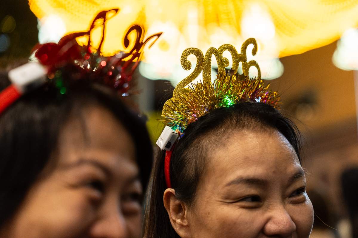 People attend the New Year countdown event to celebrate the start of 2026 in the Central district of Hong Kong, on Wednesday, Dec. 31, 2025.
