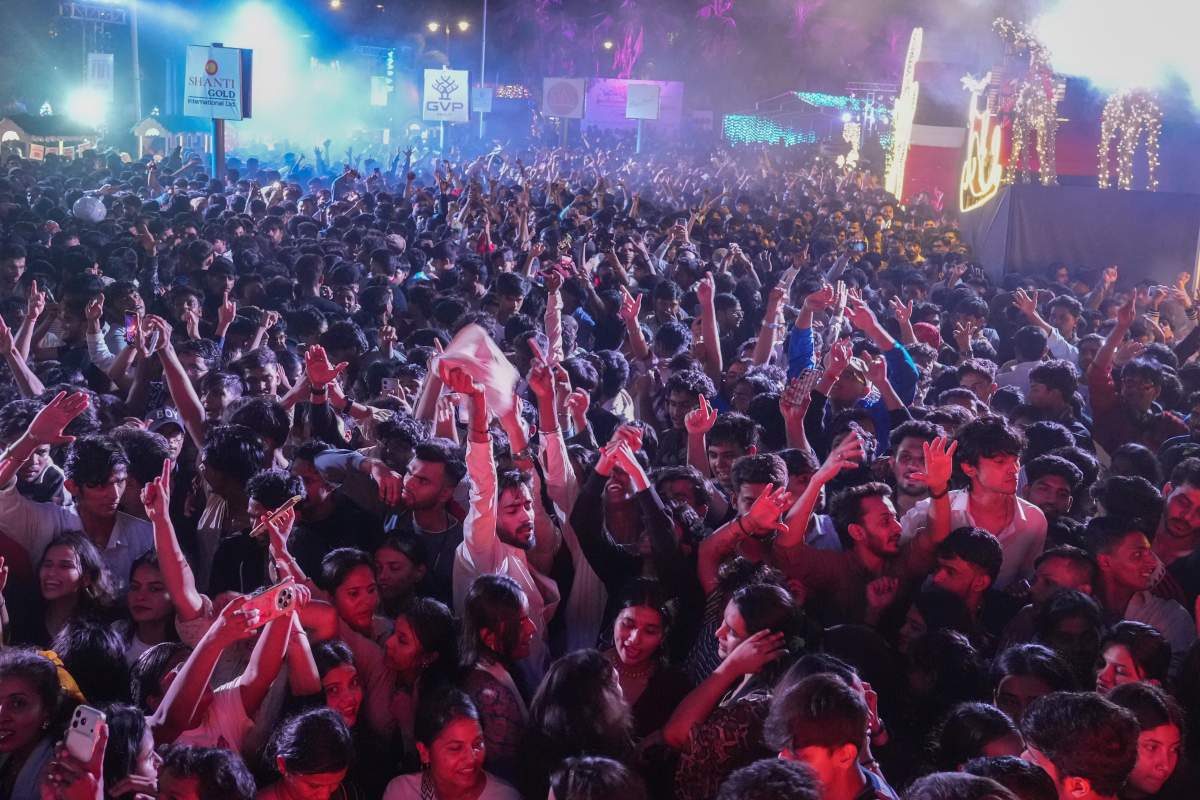People celebrate New Year's eve at a promenade in Mumbai, India, Tuesday, Dec. 31, 2025.