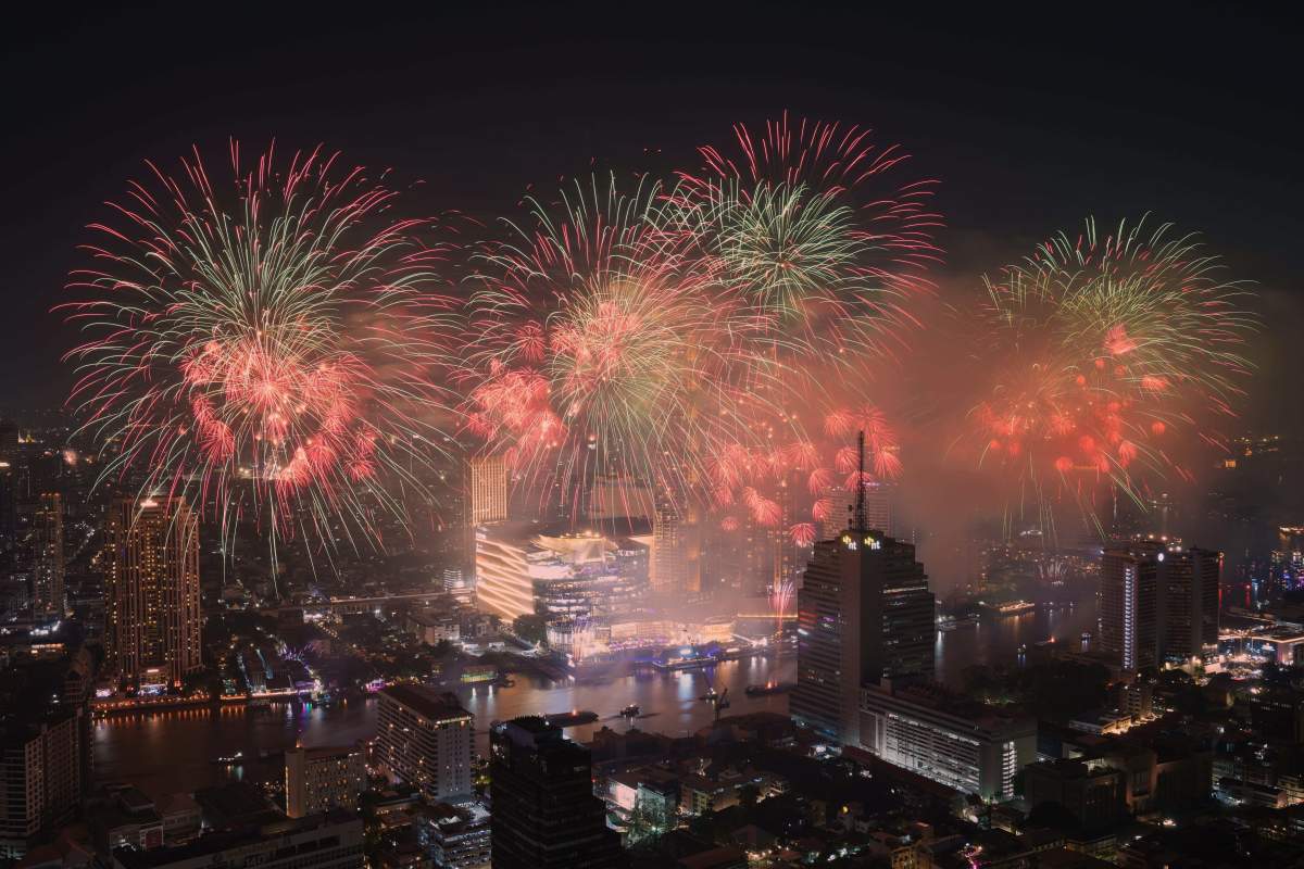 Fireworks explode over the Chao Phraya River during New Year celebrations in Bangkok, Thailand, Thursday, Jan. 1, 2026.