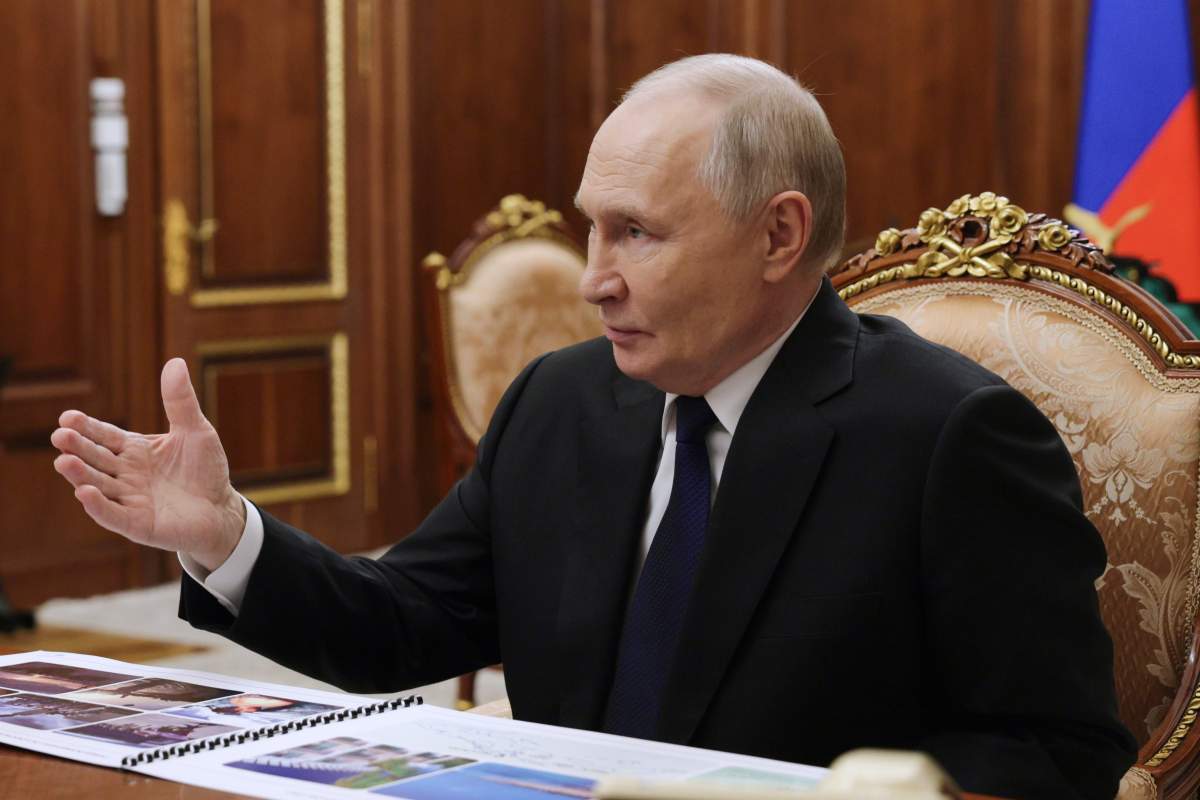 Russian President Vladimir Putin gestures while speaking to Russian Deputy Defense Minister and chairwoman of the Defenders of the Fatherland Foundation Anna Tsivileva during their meeting at the Kremlin in Moscow, Russia, Tuesday, Dec. 30, 2025.