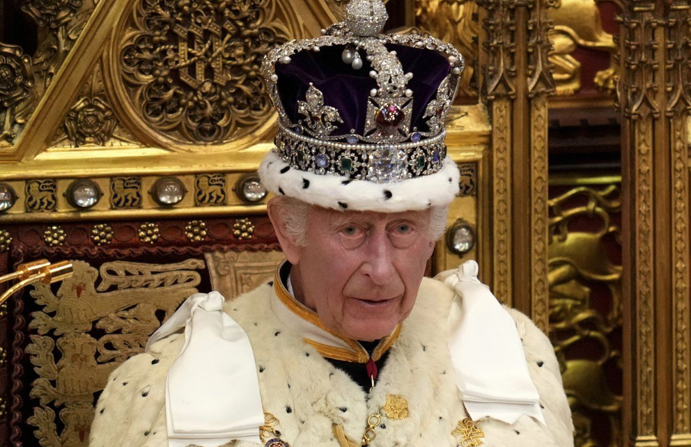 King Charles III wearing the Crown Jewels.