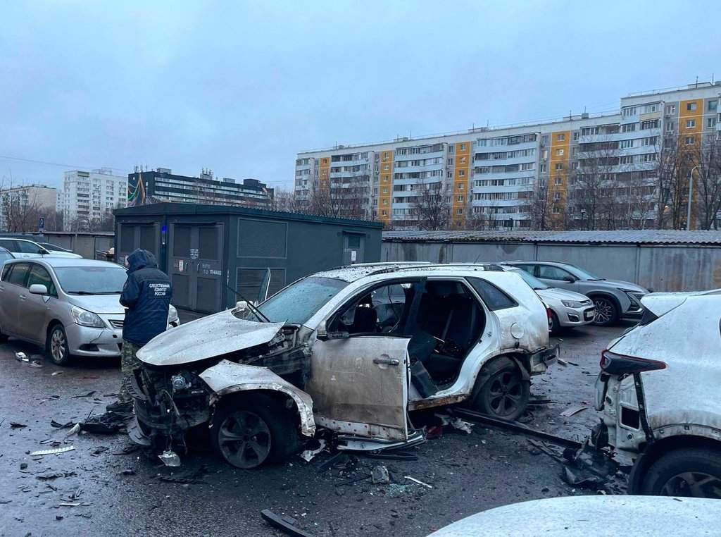 This photo provided by Investigative Committee of Moscow on Monday, Dec. 22, 2025, shows an investigator working at the scene where Lt. Gen. Fanil Sarvarov, head of the Operational Training Directorate of the Russian Armed Forces General Staff, was killed by an explosive device placed under his car in Moscow.