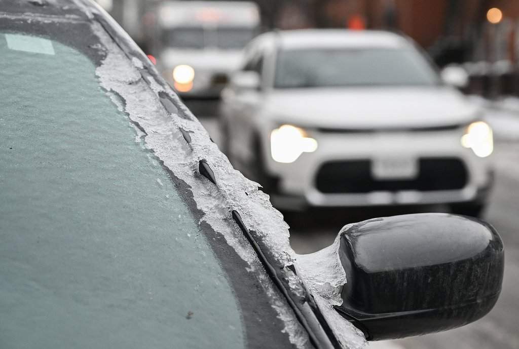 Ice covers the windscreen of a car in Montreal, Monday, Dec. 29, 2025, following a storm which dumped around 15 millimetres of freezing rain in the area. THE CANADIAN PRESS/Graham Hughes.