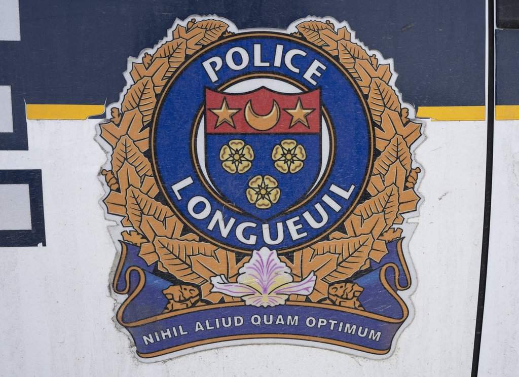 A Longueuil police emblem is seen in Longueuil, Que., Wednesday, Feb. 22, 2023. THE CANADIAN PRESS/Ryan Remiorz.