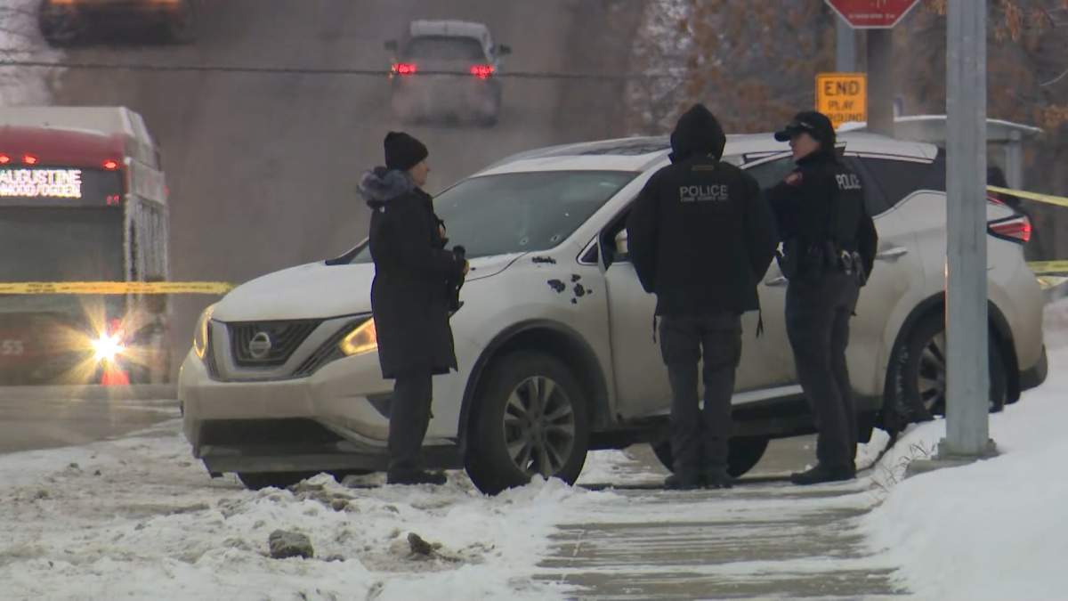 Calgary police homicide investigators are seen looking for evidence at the scene of a fatal shooting in the southeast community of Ogden in the early morning of Wednesday, Dec., 10.