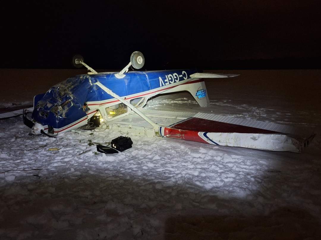 A Cessna 172N plane sits on its back near Sarnia Chris Hadfield Airport on Friday, Dec. 12, 2025 after it crashed.