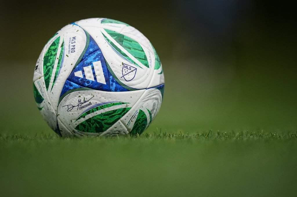 A soccer ball with the MLS logo and Commissioner Don Garber's signature sits on the pitch as the Vancouver Whitecaps practice, in Vancouver, on Wednesday, Oct. 22, 2025. 