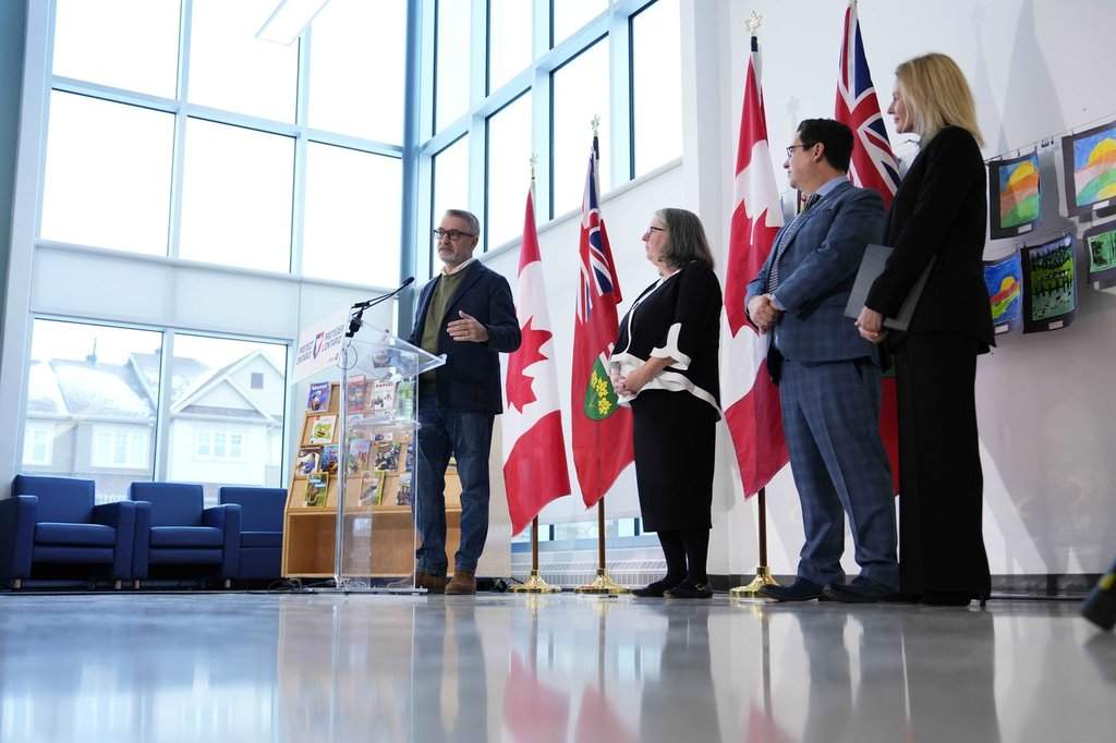 Ontario Education Minister Paul Calandra, left, speaks at an announcement at a school in Ottawa, with the directors of education of regional school boards, on Friday, Dec. 5, 2025. 