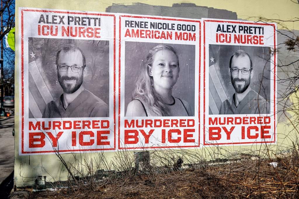 Posters depicting Alex Pretti and Renee Nicole Good are displayed on a wall near the site where Pretti, a 37-year-old ICU nurse, was fatally shot by federal immigration agents, in Minneapolis, Minn., Thursday, Jan. 29, 2026.