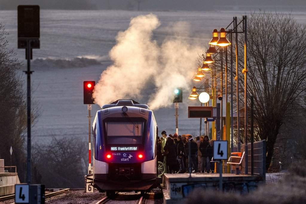 Steam rises from a hydrogen train at a station in Wehrheim near Frankfurt, Germany, early Wednesday, March 5, 2025. (AP Photo/Michael Probst).