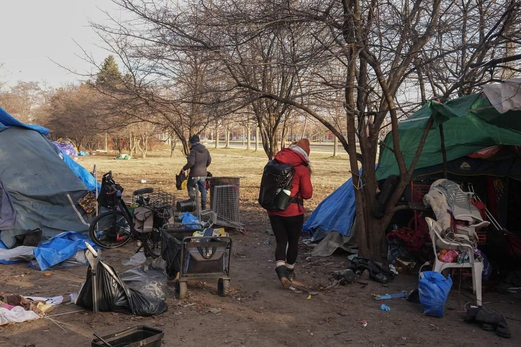 Outreach workers distribute cold weather supplies to encampment residents as temperatures plummet in Toronto on Wednesday, Jan. 8, 2025.