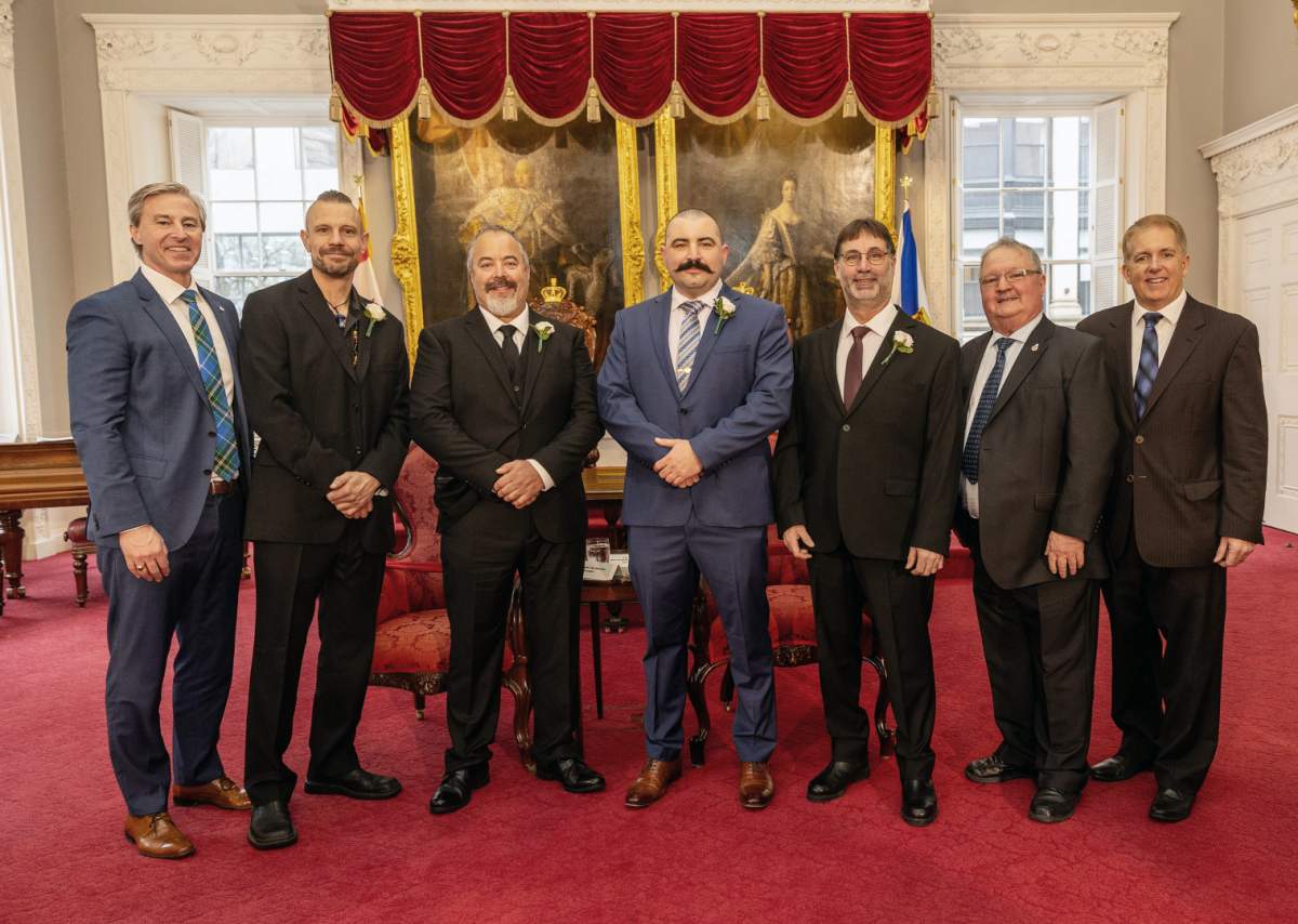 From left, Premier Tim Houston; medal recipients Gerrid Hunt, Richard MacPhee, Ryan O’Shea and Scott Rafuse; Tom Steele, chair, Medal of Bravery Advisory Committee; and Attorney General and Justice Minister Scott Armstrong.