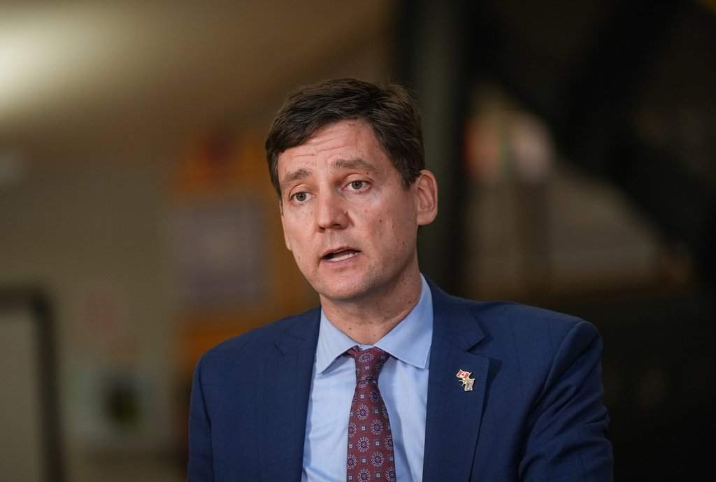 Students watch as B.C. Premier David Eby speaks during a news conference at Clayton Heights Secondary School, in Surrey, B.C., on Thursday, September 4, 2025. THE CANADIAN PRESS/Darryl Dyck.