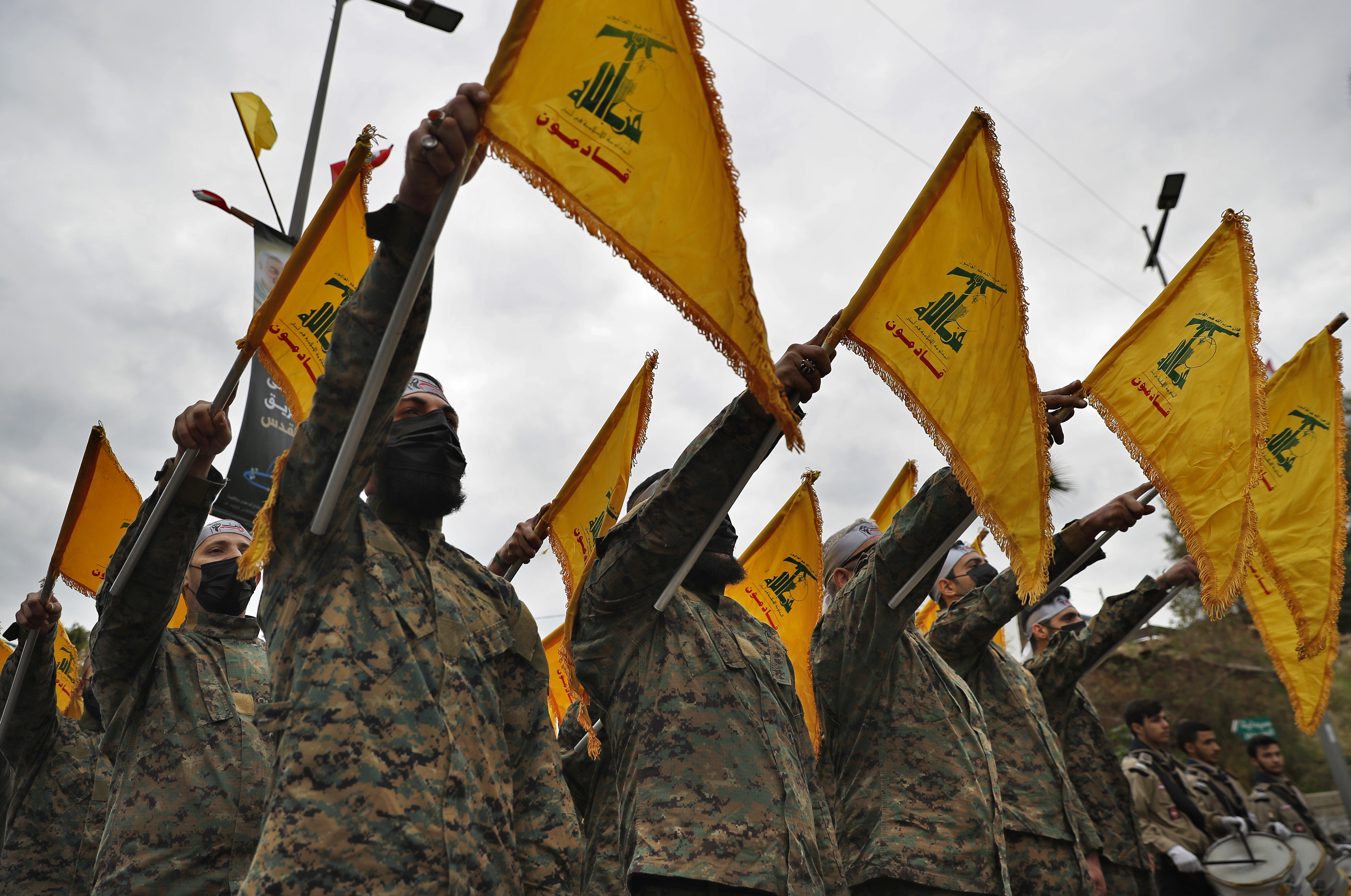 Hezbollah fighters pledge allegiance to Iranian General Qassem Soleimani on the second anniversary of his assassination, Beirut, Lebanon, Jan. 4, 2022.