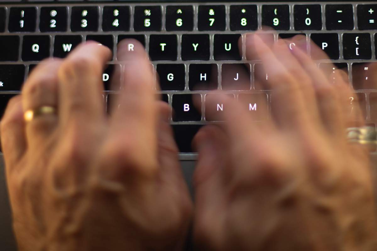 A man using a computer keyboard
