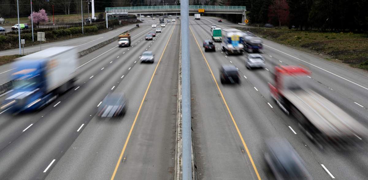 FILE - Cars and trucks travel on Interstate 5 near Olympia, Wash., March 25, 2019. (AP Photo/Ted S. Warren, File).