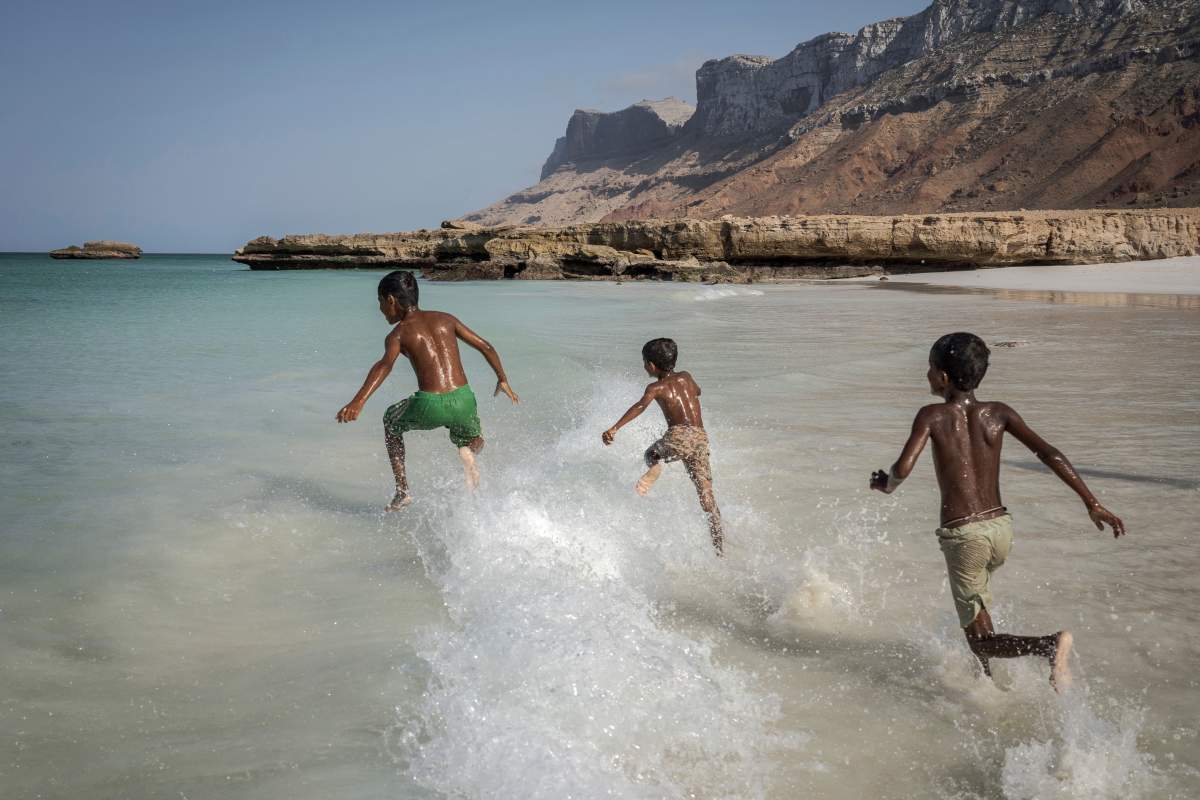 FILE: Children play in the waves on the Yemeni island of Socotra, on Sept. 22, 2024.