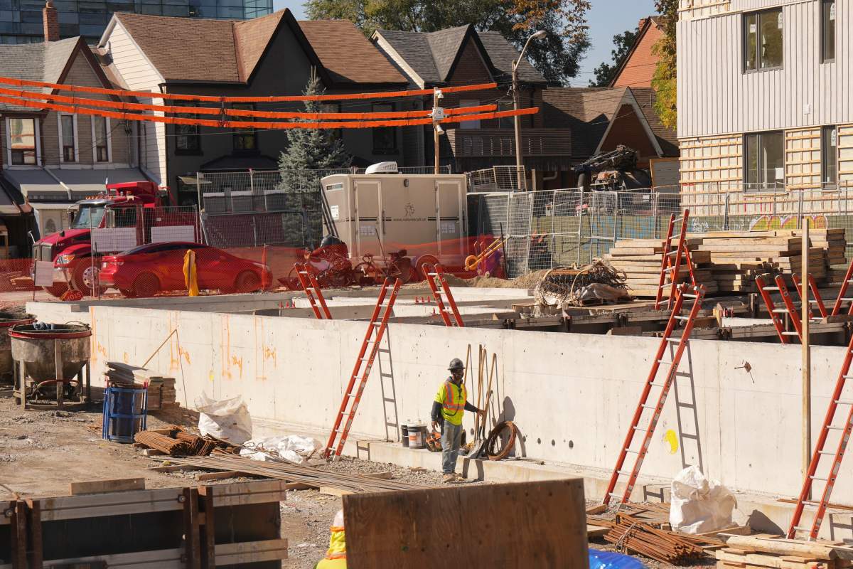 Construction is seen on a 78-unit, four-storey building with affordable homes, in Toronto's Kensington Market, on Thursday, October 9, 2025. 
