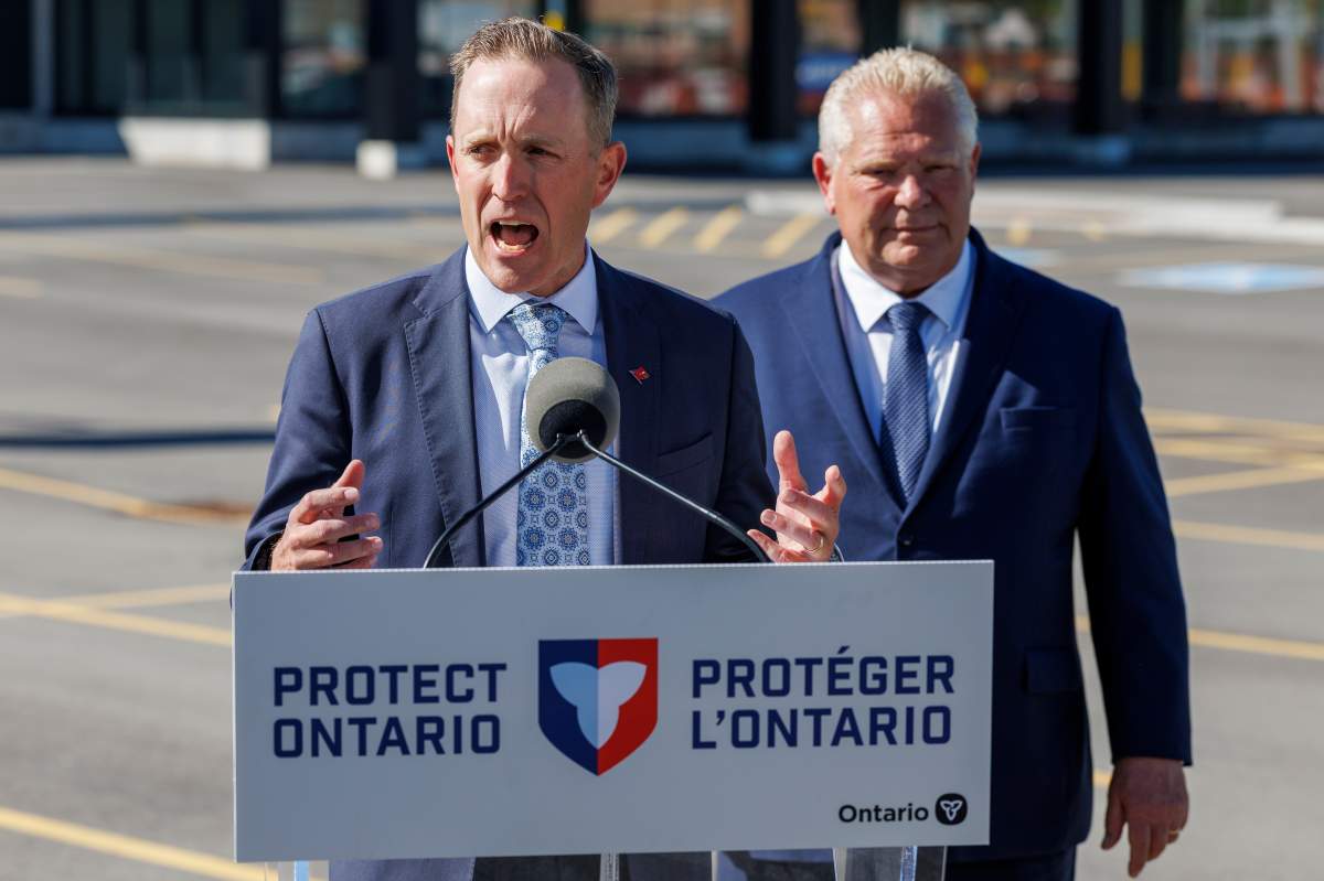 The President and CEO of Metrolinx Michael Lindsay speaks while Ontario Premier Doug Ford looks on during a transportation announcement at Confederation GO Station in Hamilton, Ont,. on Monday September 29, 2025. 