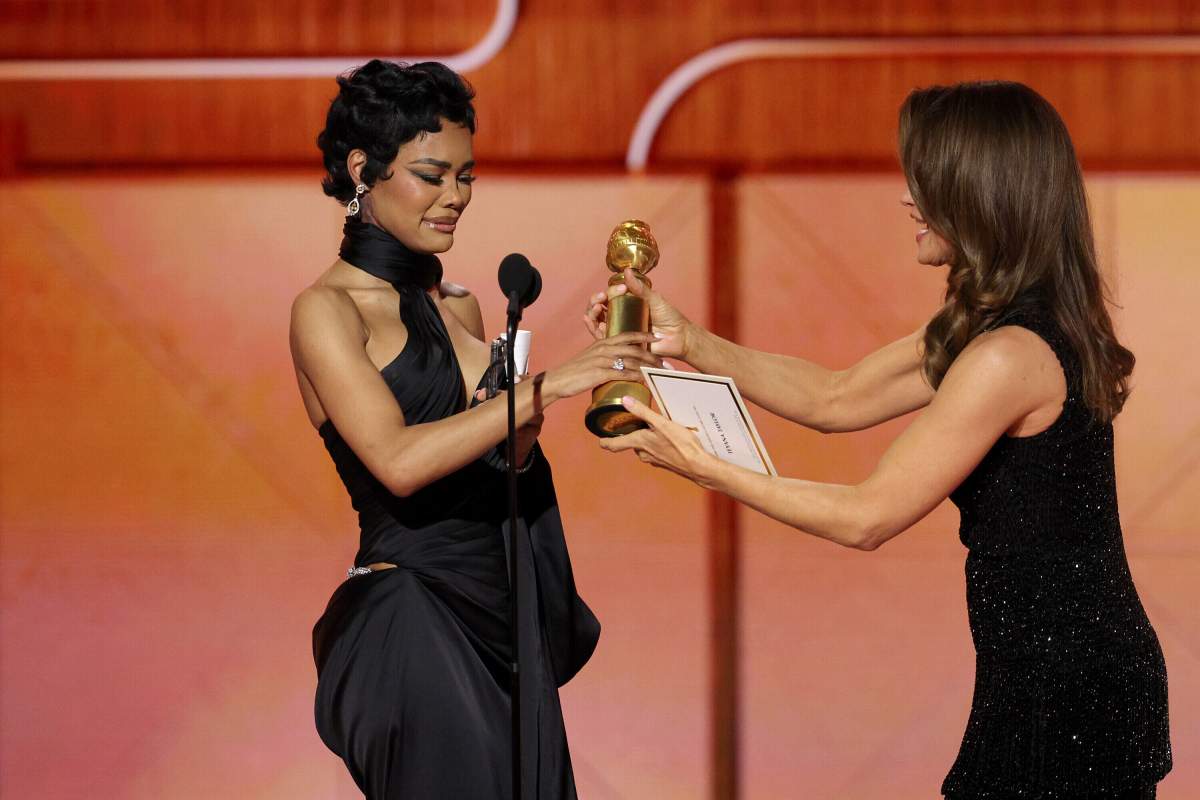 This image released by CBS Broadcasting shows Teyana Taylor, left, accepting the award for best performance by a supporting actress in a motion picture for 'One Battle After Another,' from presenter Jennifer Garner, during the 83rd Golden Globes on Sunday, Jan. 11, 2026, at the Beverly Hilton in Beverly Hills, Calif.