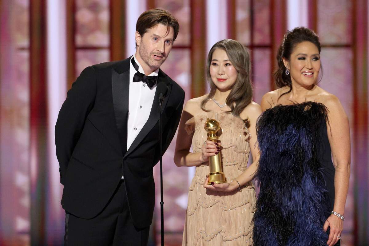 This image released by CBS Broadcasting shows Chris Appelhans, from left, Maggie Kang and Michelle Wong accepting the award for best animated motion picture for 'KPop Demon Hunters' during the 83rd Golden Globes on Sunday, Jan. 11, 2026, at the Beverly Hilton in Beverly Hills, Calif.