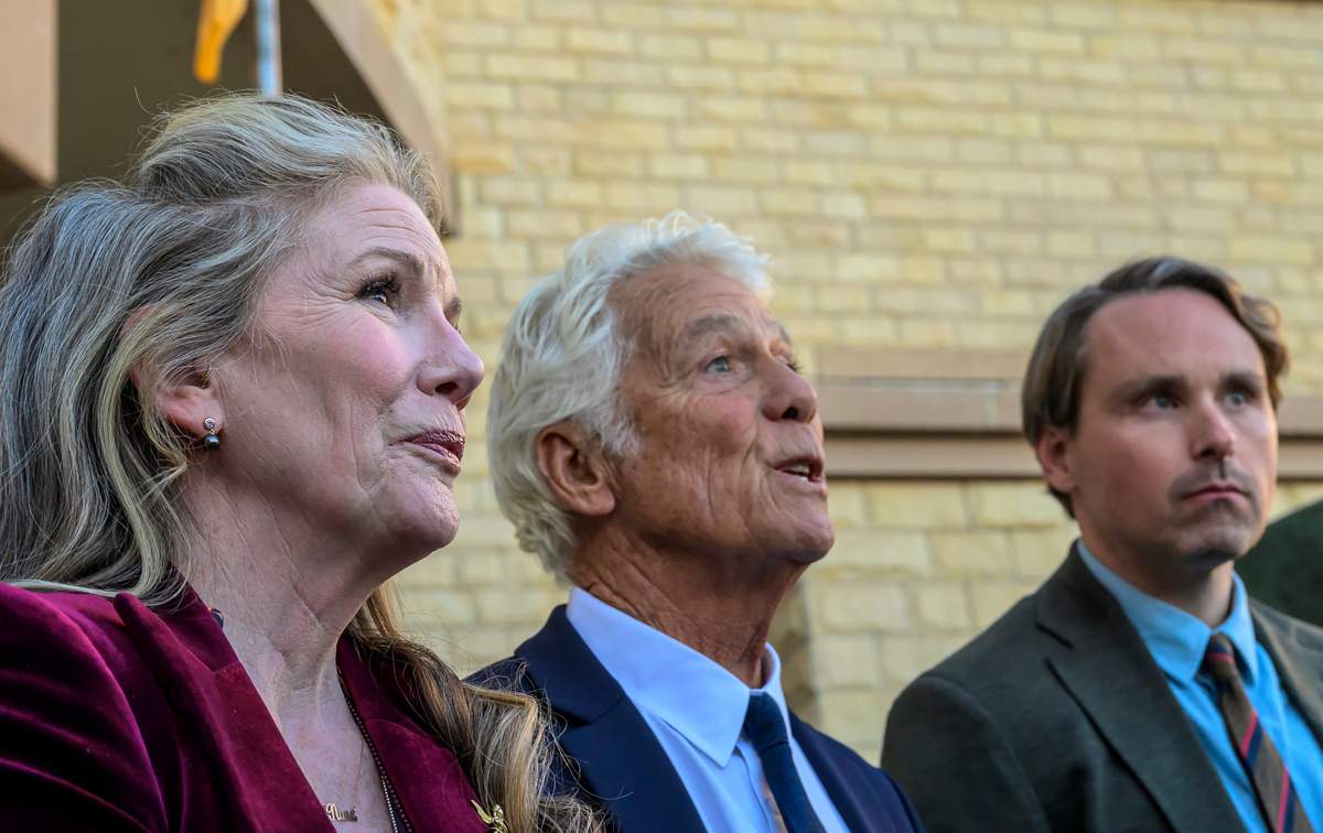 Actor Timothy Busfield's wife Melissa Gilbert, left, and lawyer Larry Stein center, along with lawyer Chris Dodd stand in front of the Bernalillo County Courthouse in Albuquerque, N.M.