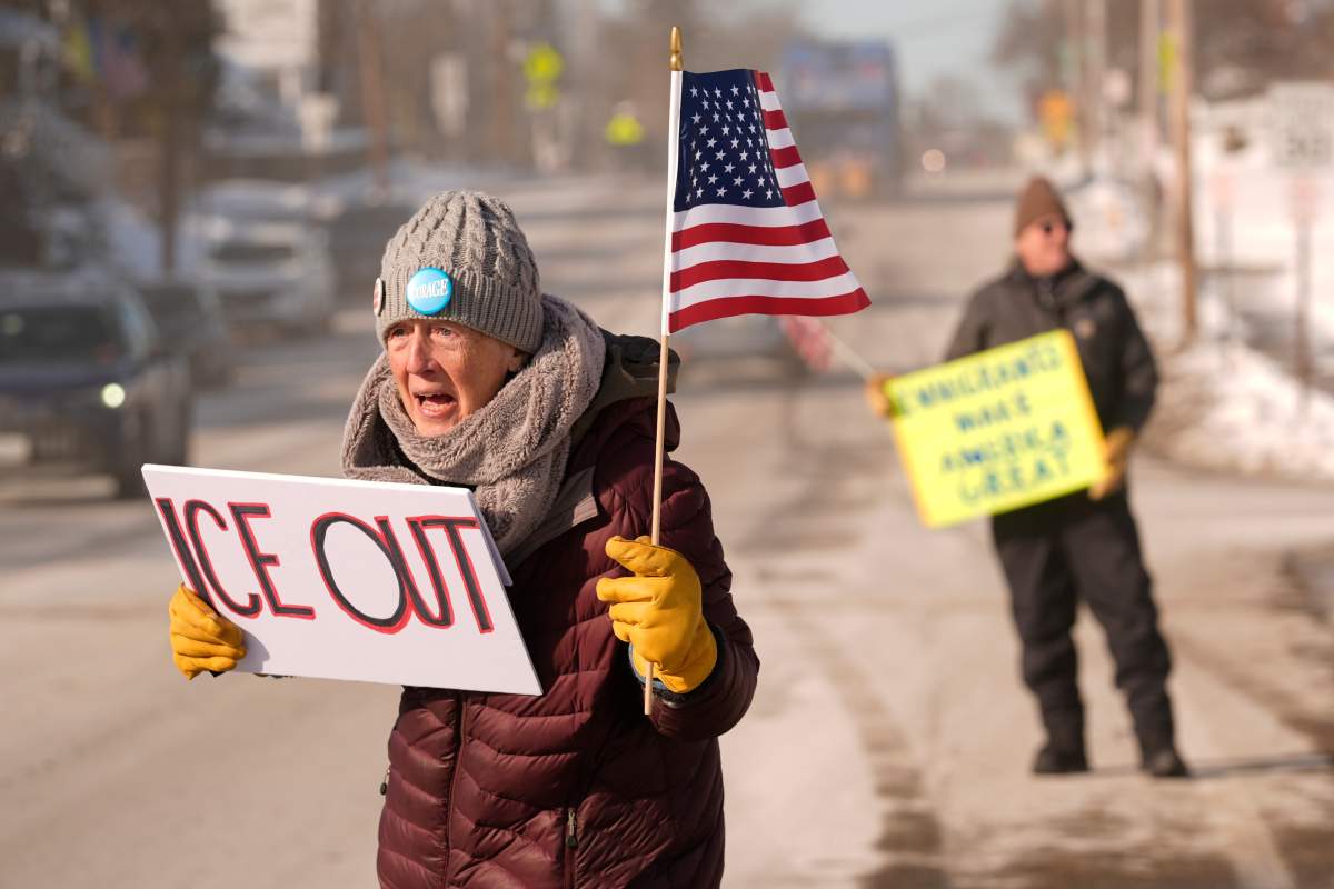 Rosie Grutze protests the presence of the U.S. Immigration and Customs Enforcement, Wednesday, Jan. 21, 2026, in Portland, Maine.