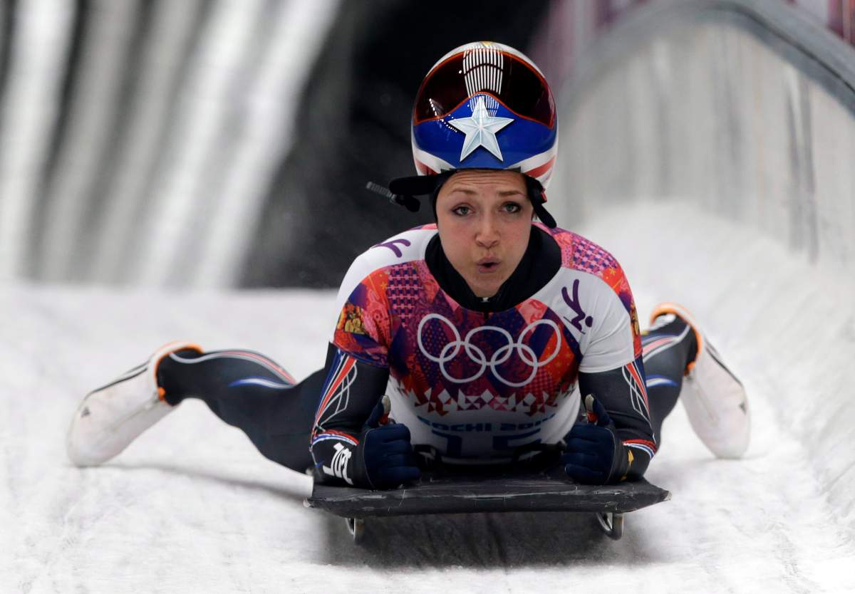 FILE - Katie Uhlaender of the United States brakes after her final run during the women's skeleton competition at the 2014 Winter Olympics, Friday, Feb. 14, 2014, in Krasnaya Polyana, Russia.