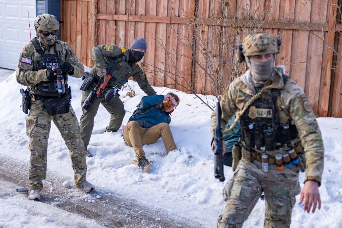 January 10, 2026, Minneapolis, Minnesota, USA: A U.S. Border Patrol agent holds down a bystander who was sprayed with chemical irritant while attempting to block an ICE vehicle from leaving the scene where Renee Good was shot and killed by Jonathan Ross, an ICE agent, in Minneapolis on Jan. 7, 2026.