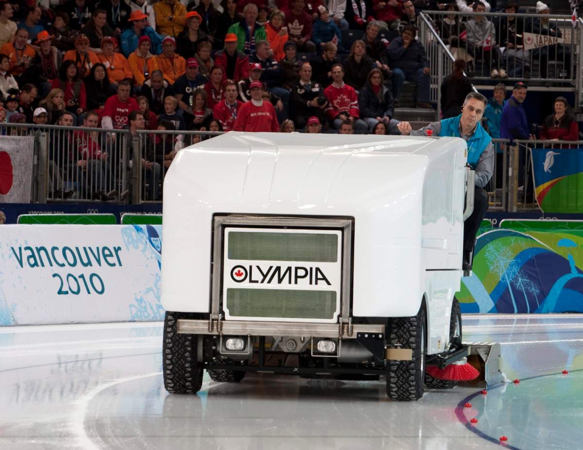 Olympic Oval ice maker Mark Messer drives the backup ice cleaning machine during a break in the action at the men's 500m long track speedskating event at the 2010 Vancouver Winter Olympic Winter Games.