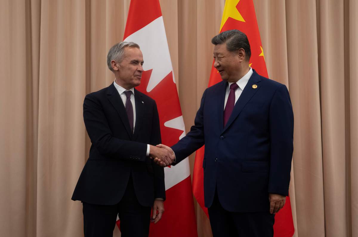 Prime Minister Mark Carney shakes hands with Chinese President Xi Jinping at the start of a meeting in Gyeongju, Friday, Oct. 31, 2025.