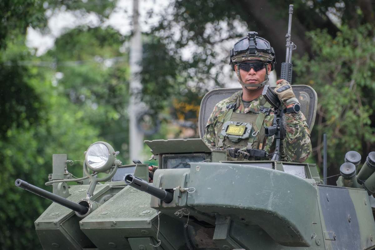 A Colombian soldier monitors the Venezuelan border. The Colombian government declared a state of emergency and deployed the military after U.S. forces seized Venezuelan President Nicolas Maduro.