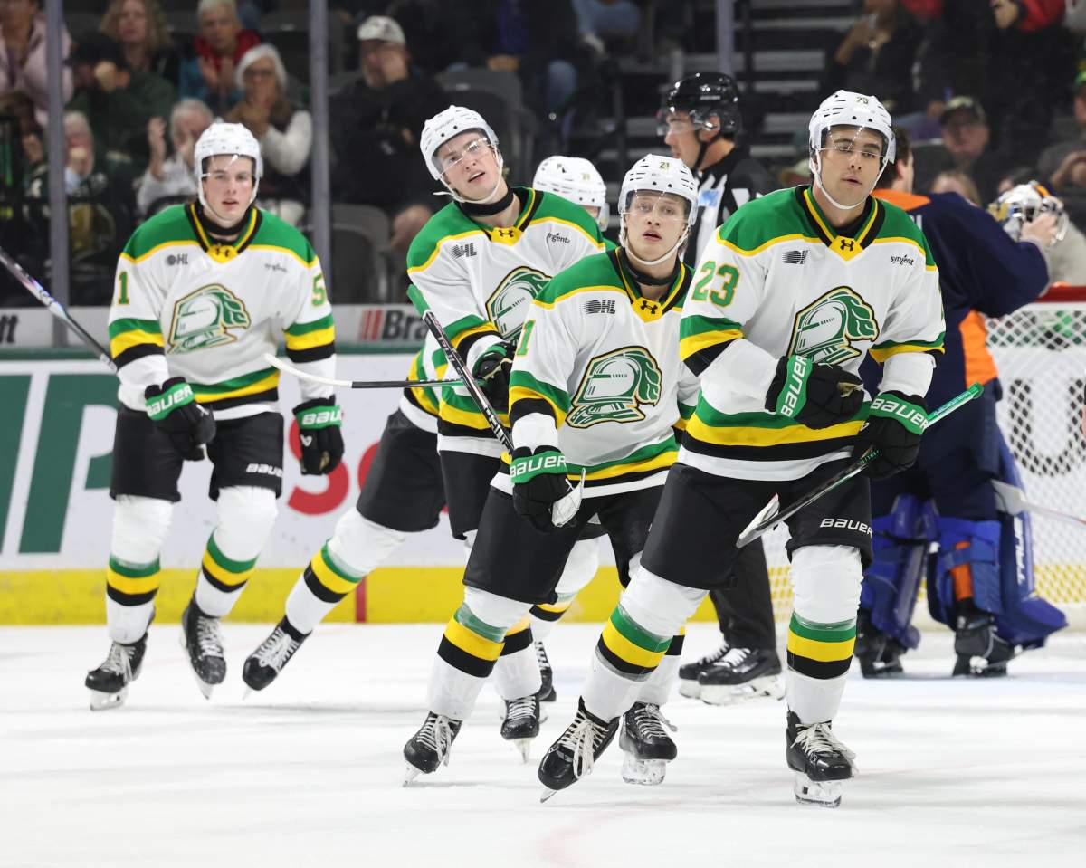 Sam O'Reilly and Jared Woolley take part in a London Knights goal celebration.